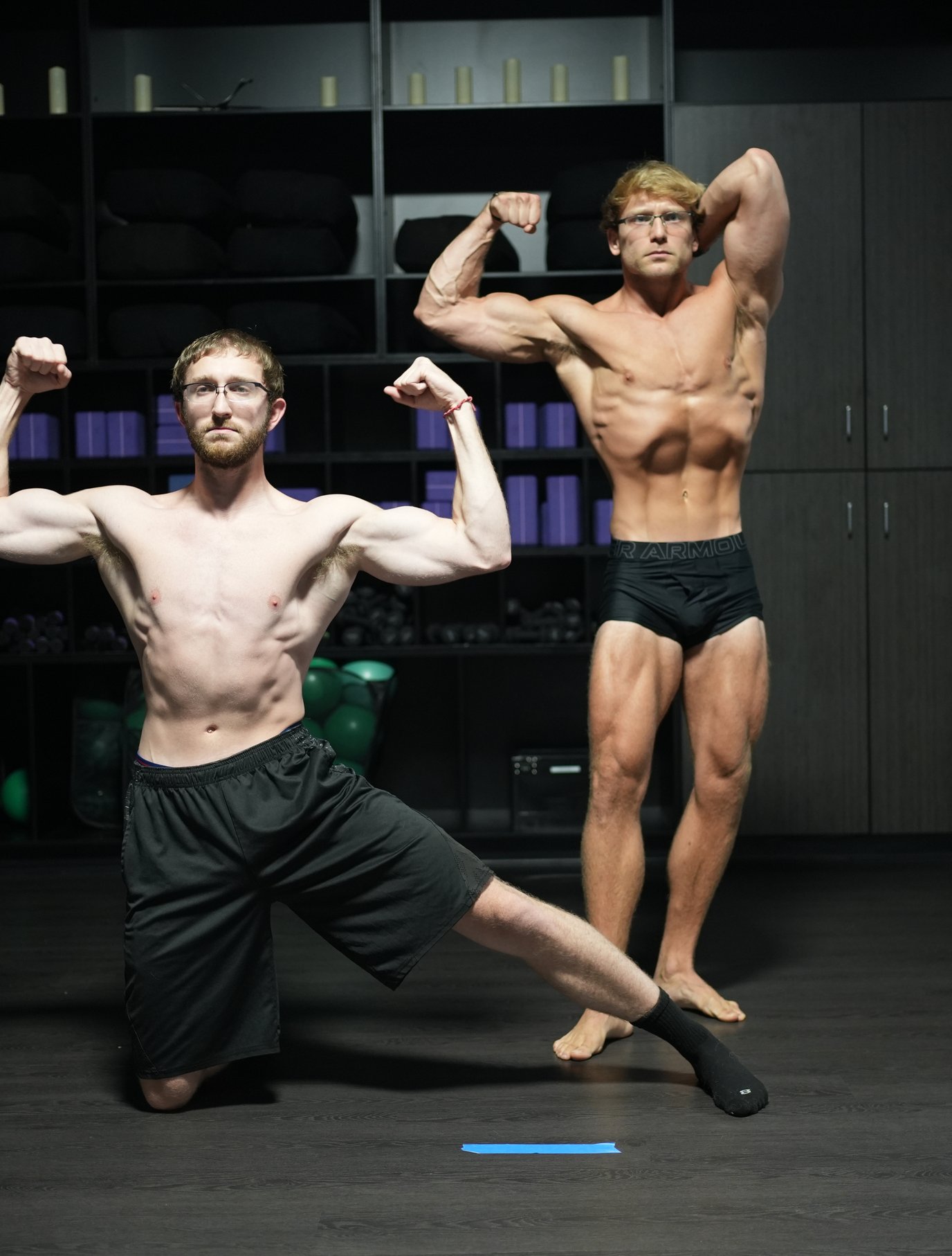 Sam and Nick Rosin flexing in the gym locker room