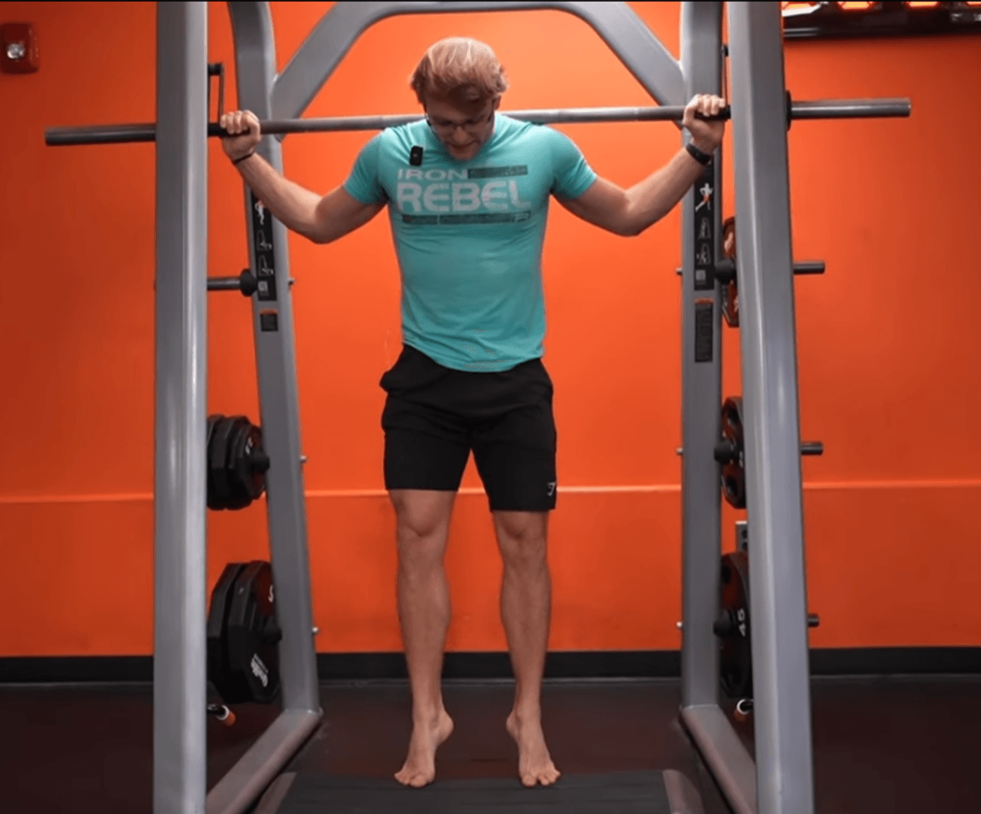 B4 Fitness trainer demonstrating a pull-up