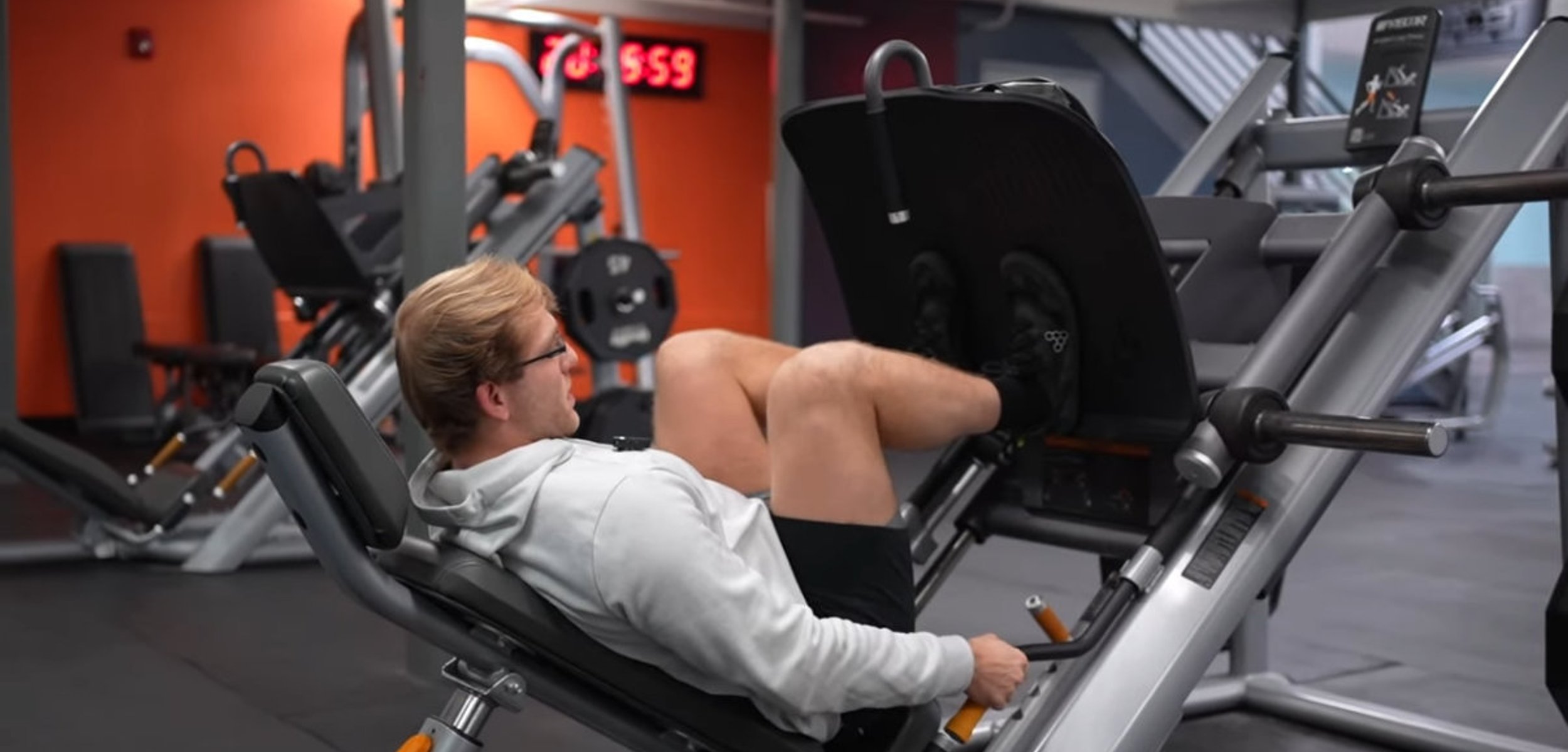 Person deadlifting a barbell with controlled form