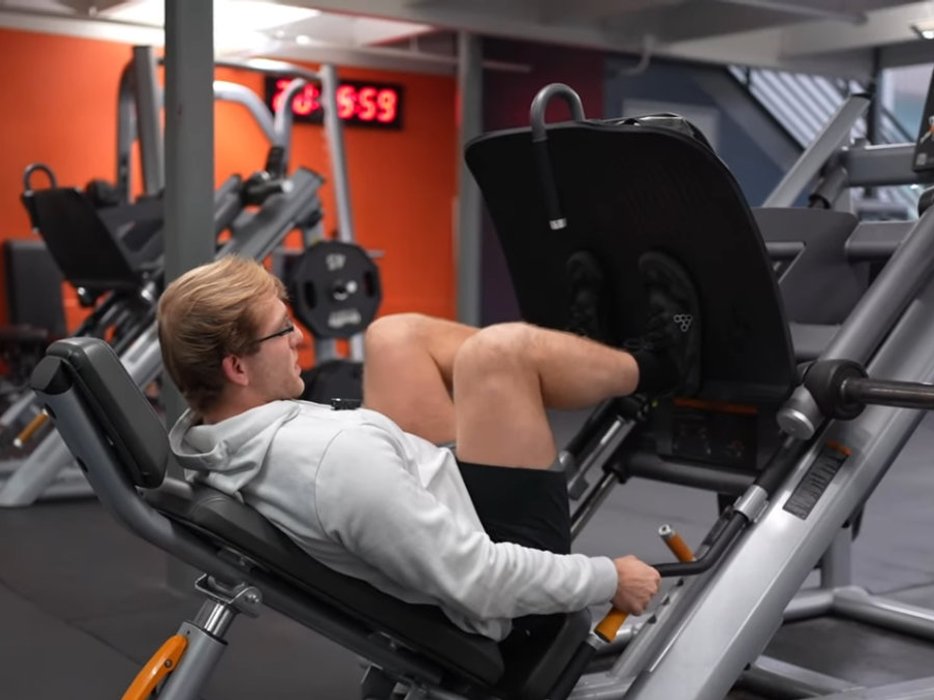Person deadlifting a barbell with controlled form