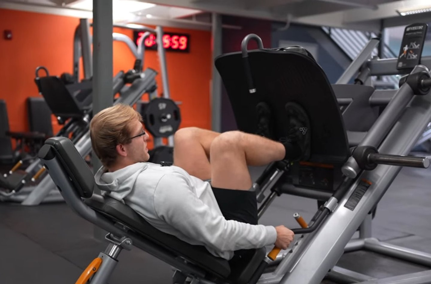 Person deadlifting a barbell with controlled form