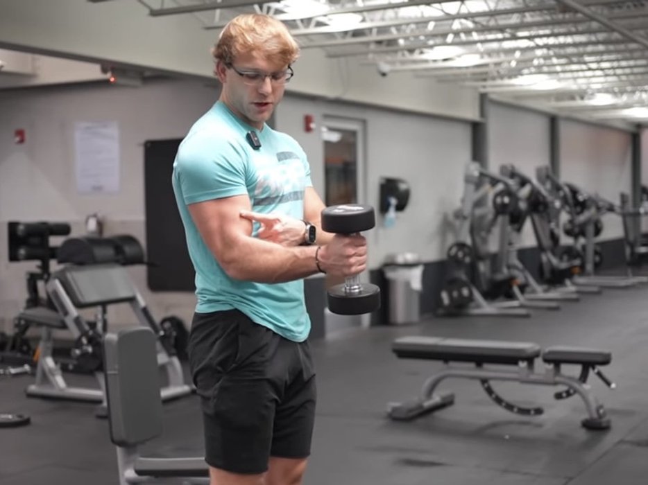 Personal trainer reviewing a weekly schedule on a tablet